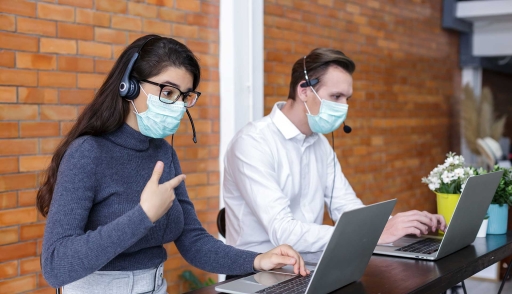 Call center representatives working in masks